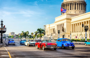 Vintage cars at rush hour in the morning in front of capitolio in La Havana, Cuba